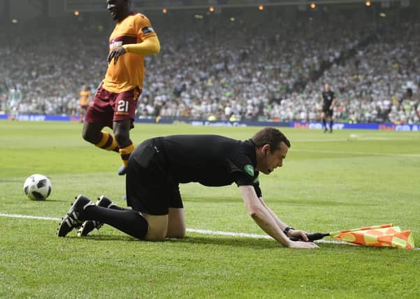 Tory MP and assistant referee Douglas Ross takes a tumble at Hampden Park but should take a bow for his resignation from the UK Government over the Dominic Cummings affair (Picture: John Devlin)