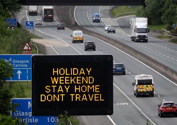 Motorway signage on the M80 at Banknock urging motorists to stay at home. Picture: PA