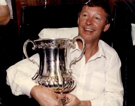 Sir Alex Ferguson with the FA Cup in 1990 after Manchester United's victory over Crystal Palace in the Cup final replay. Picture: Jim Hutchison/ANL/Shutterstock