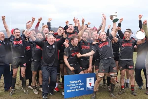 The Biggar players celebrate their title 'win'.