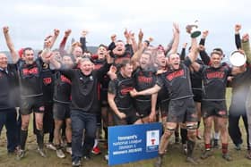 The Biggar players celebrate their title 'win'.