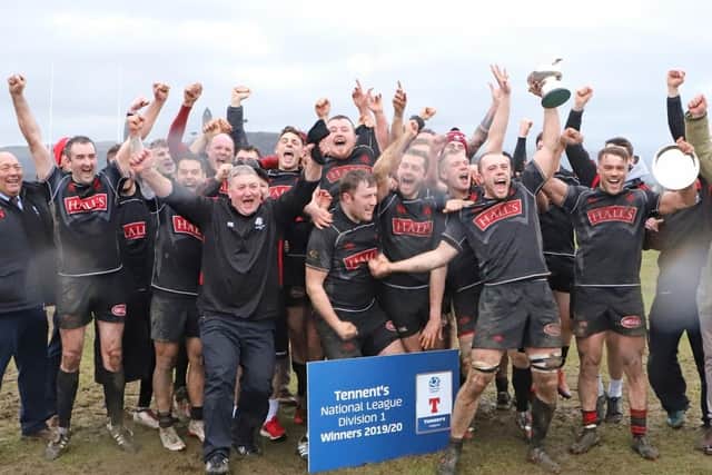 The Biggar players celebrate their title 'win'.