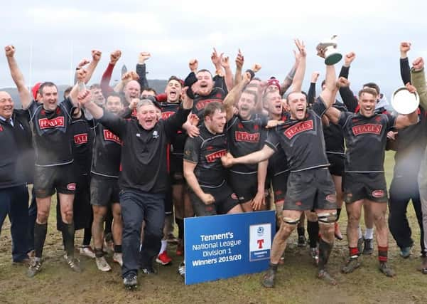 The Biggar players celebrate their title 'win'.