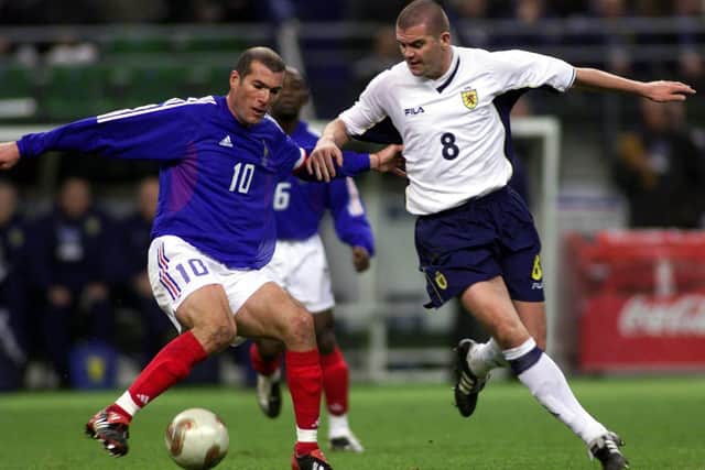 Dominic Matteo takes on Zinedine Zidane during a friendly match between Scotland and France in Paris 2002. Picture: SNS