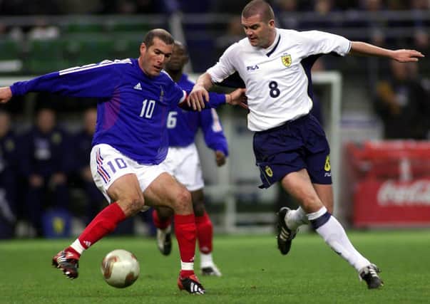 Dominic Matteo takes on Zinedine Zidane during a friendly match between Scotland and France in Paris 2002. Picture: SNS