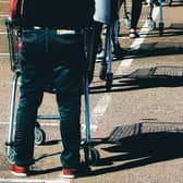 Remember to keep your distance while queueing. Picture: David Rogers/Getty