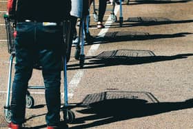 Remember to keep your distance while queueing. Picture: David Rogers/Getty