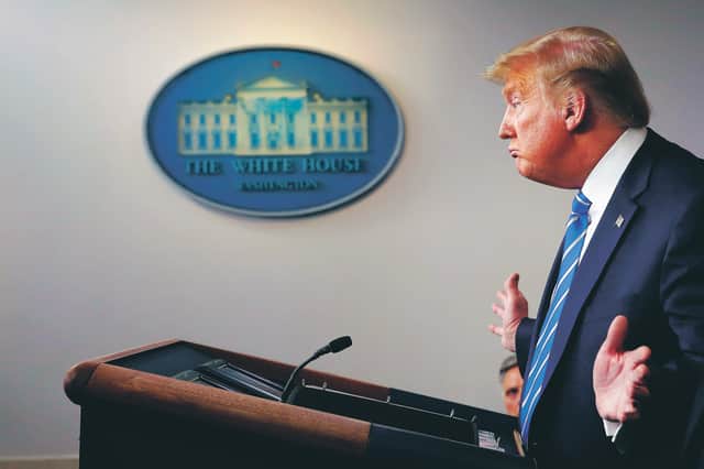 President Trump gauges the response to his unorthodox remedies at last week's press briefing. Picture: Alex Brandon/AP