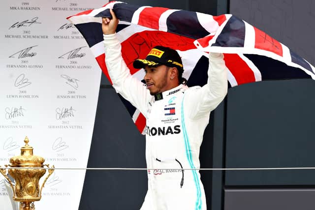 Lewis Hamilton celebrates his British Grand Prix at Silverstone last year. He will defend that title without his fans present. Picture: Getty