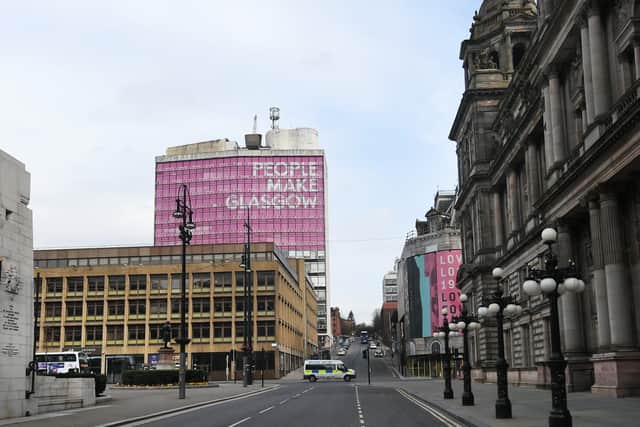 The 'People Make Glasgow' brand is displayed prominently on the former Charles Oakley college building overlooking George Square. Picture: John Devlin