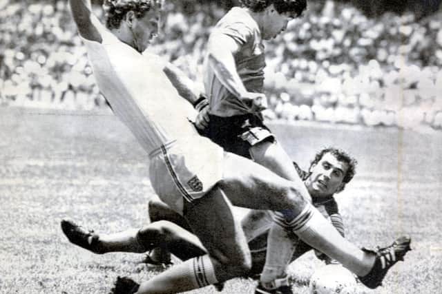 Diego Maradona scores after a 60-yard sprint in which he evaded the despairing lunges of a host of England players. Picture: Ted Blackbrow/Daily Mail/Shutterstock