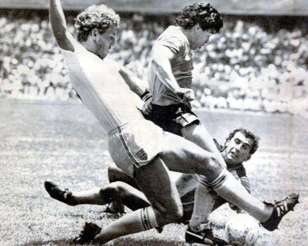 Diego Maradona scores after a 60-yard sprint in which he evaded the despairing lunges of a host of England players. Picture: Ted Blackbrow/Daily Mail/Shutterstock