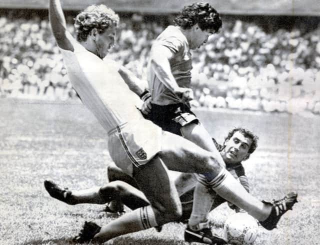 Diego Maradona scores after a 60-yard sprint in which he evaded the despairing lunges of a host of England players. Picture: Ted Blackbrow/Daily Mail/Shutterstock