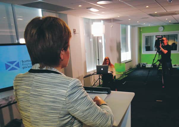 Nicola Sturgeon at the daily press conference - an empty room