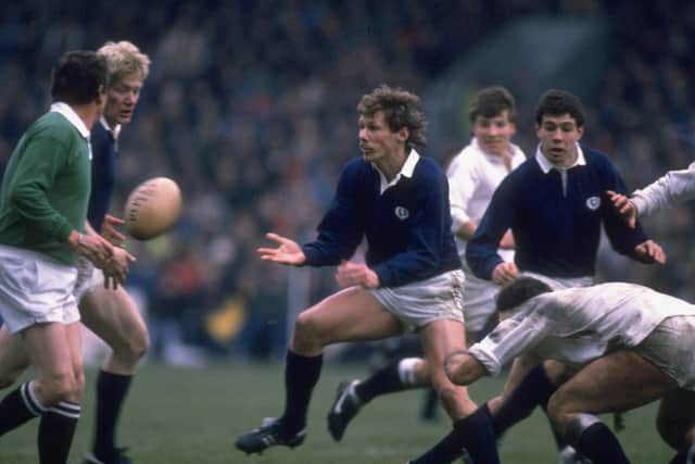 John Rutherford passes the ball to John Jeffrey during Scotland's 33-6 demolition of England in the 1986 Calcutta Cup match at Murrayfield. Picture: Getty Images