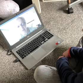 Bo, a pupil at the Royal Blind School receives an online lesson from Royal Blind School teacher Pam Young