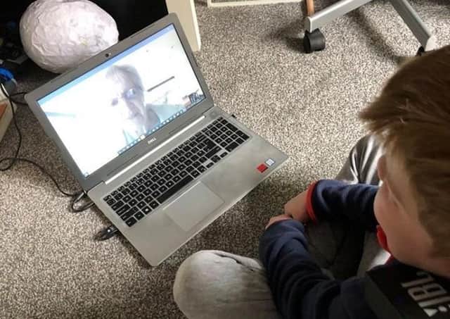 Bo, a pupil at the Royal Blind School receives an online lesson from Royal Blind School teacher Pam Young