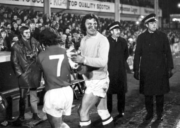 Jim Herriot, who used to rub mud under his eyes to stop the glare from the floodlights, after a Hibs-Rangers match at Easter Road in March 1973.