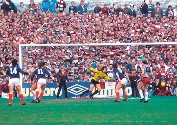 Dundee's Albert Kidd (No 14) delivered two devastating blows to Hearts' title bid. Picture: SNS