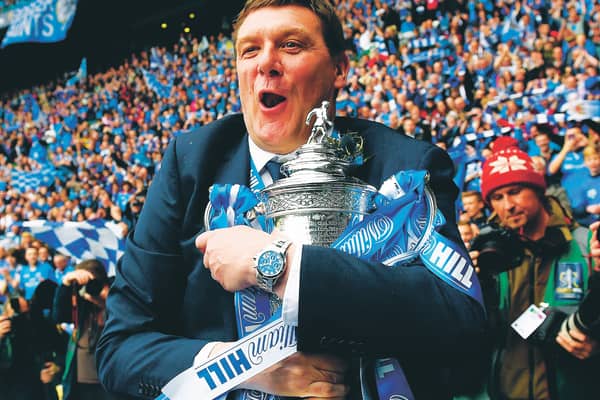 St Johnstone manager Tommy Wright clutches the Scottish Cup after the club's 2014 success. Picture: Craig Williamson/SNS