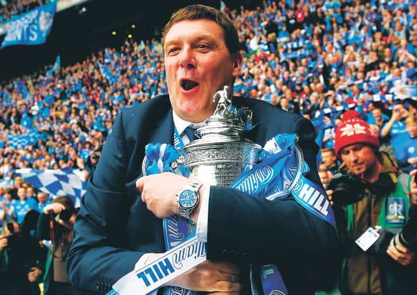 St Johnstone manager Tommy Wright clutches the Scottish Cup after the club's 2014 success. Picture: Craig Williamson/SNS