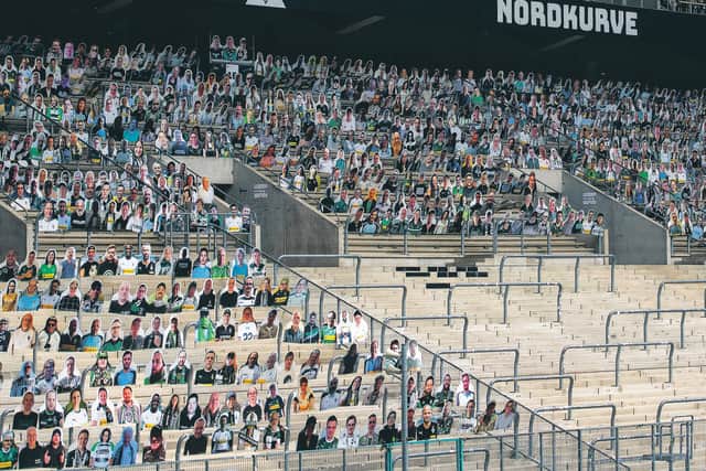 Some supporters in Germany will be paying £17 to have cardboard cut-outs of themselves at matches if the season resumes behind closed doors. Picture: Marius Becker/dpa via AP
