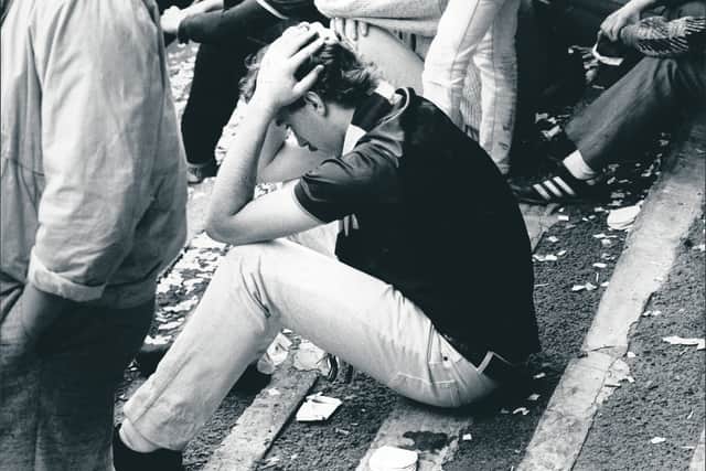 A Hearts fan holds his head in his hands after the league title had slipped away in 1986.