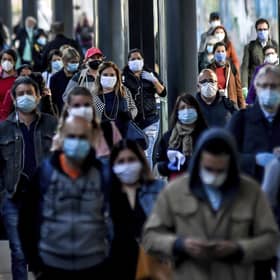 Commuters return to work in Milan, Italy. Britain is facing a similar challenge to get employees back into work and to restart the UK economy. Picture: Claudio Furlan/LaPresse via AP