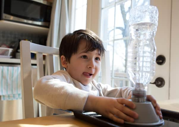 You can recreate a tornado at home, using everyday items from your kitchen, like this little boy