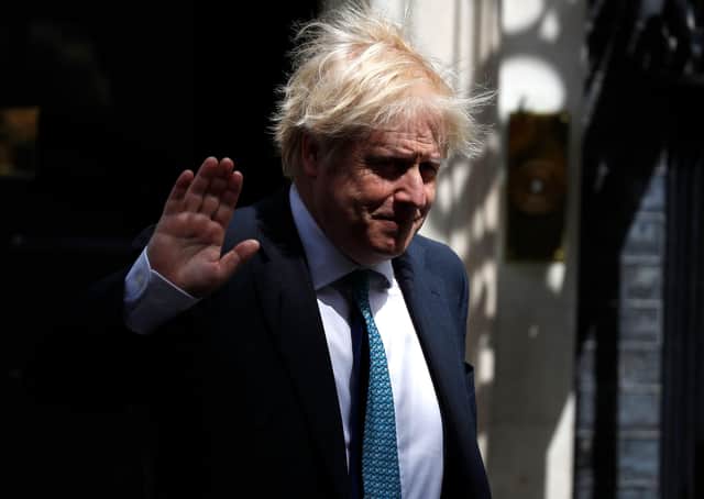 Boris Johnson is trying to project himself as both a caring and cautious PM and a gung-ho free marketeer (Picture: Tolga Akmen/AFP via Getty Images)