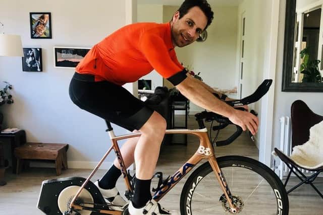 Cyclist Mark Beaumont on the turbo trainer in his living room.