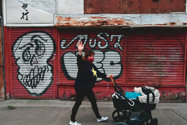 Janey Godley catches up on her daily exercise and has a message for us all: "Dont go out without your mask." 
(Her dog Honey, who was rehomed with Godley, is nervous around people so sometimes travels in a pram, but also walks every day.) 
Picture: John Devlin