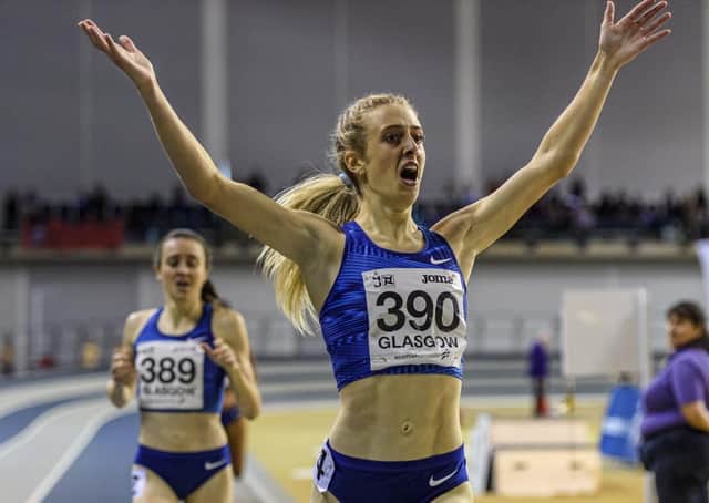 Jemma Reekie celebrates victory and a new British 800m indoor record of 1min 57.91secs in Glasgow in February with training partner Laura Muir, who finished second, in the background. Picture: Bobby Gavin