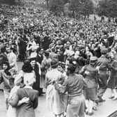A large crowd gathers at the Ross Bandstand in Princes Street Gardens to celebrate VE Day on May 8, 1945. PIC: TSPL