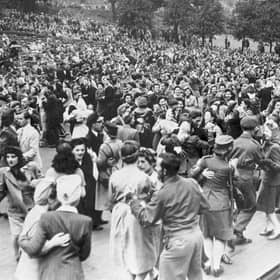 A large crowd gathers at the Ross Bandstand in Princes Street Gardens to celebrate VE Day on May 8, 1945. PIC: TSPL