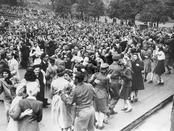 A large crowd gathers at the Ross Bandstand in Princes Street Gardens to celebrate VE Day on May 8, 1945. PIC: TSPL