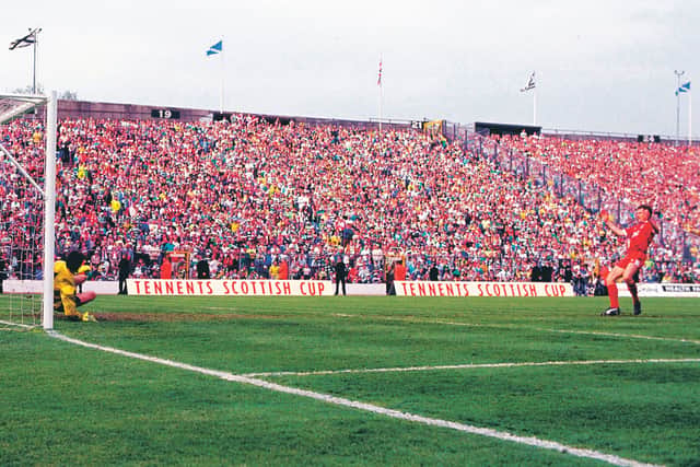 Brian Irvine side-foots his penalty past Pat Bonner to clinch victory on 12 May 1990. Picture: SNS