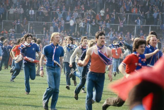 Rangers fans on the pitch at Hampden after the 1980 Scottish Cup final