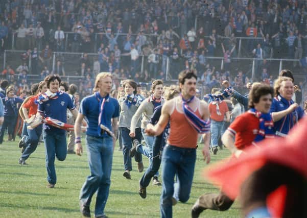 Rangers fans on the pitch at Hampden after the 1980 Scottish Cup final
