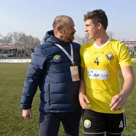 Real Kashmir manager David Robertson and his son Mason, who plays for the club, leave the pitch after winning their I-League match against Chennai City in Srinagar in January 2019. Picture: Tauseef Mustafa/AFP via Getty Images