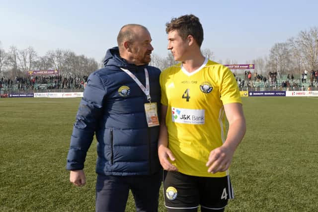 Real Kashmir manager David Robertson and his son Mason, who plays for the club, leave the pitch after winning their I-League match against Chennai City in Srinagar in January 2019. Picture: Tauseef Mustafa/AFP via Getty Images