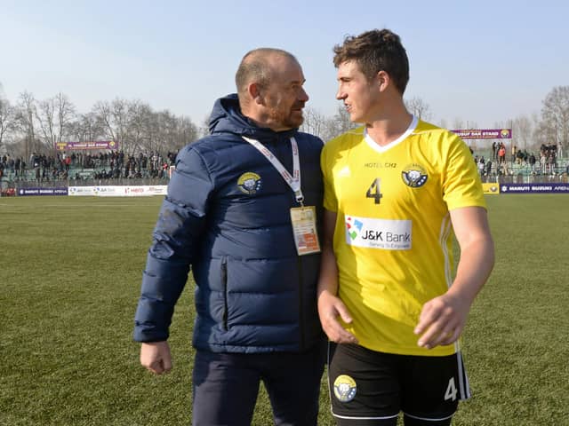 Real Kashmir manager David Robertson and his son Mason, who plays for the club, leave the pitch after winning their I-League match against Chennai City in Srinagar in January 2019. Picture: Tauseef Mustafa/AFP via Getty Images