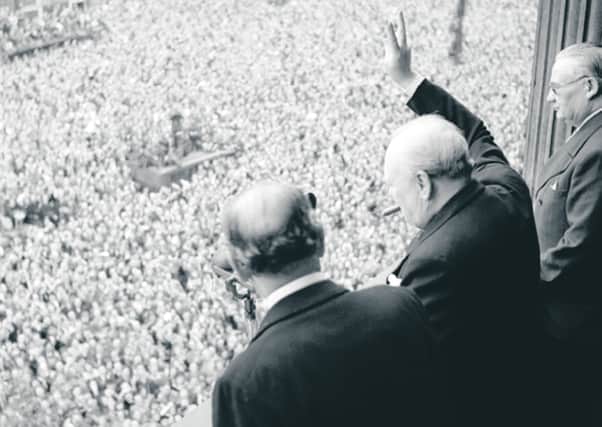 Winston Churchill waves to jubilant crowds on VE Day. Picture: Imperial War Museum