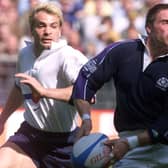Alan Tait, playing brilliant rugby late in his career,  leaves French opponent Christophe Dominici in his wake. He scored two tries in this 1999 victory. Picture: AFP/Getty.