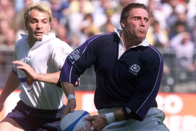 Alan Tait, playing brilliant rugby late in his career, leaves French opponent Christophe Dominici in his wake. He scored two tries in this 1999 victory. Picture: AFP/Getty.