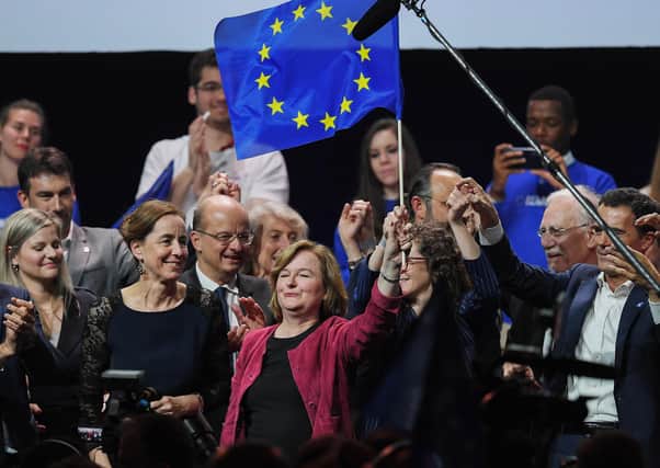 Nathalie Loiseau (C) waves a European flag during a public meeting ahead of the European elections. Picture: Getty