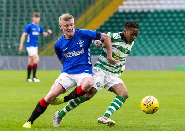 Celtic's Karamoko Dembele competes with Rangers' Reece Breen in a reserve team clash. Picture: SNS