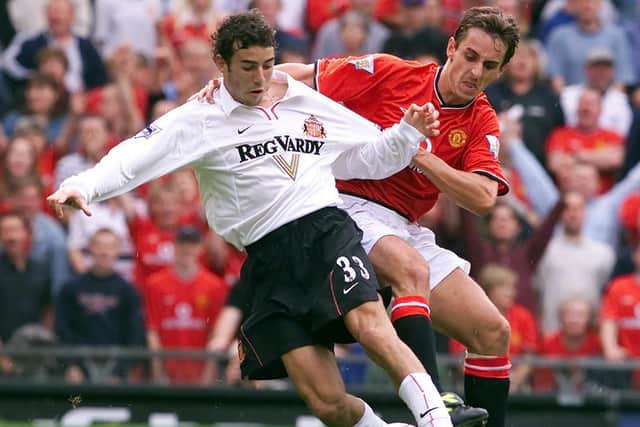 Manchester United’s Gary Neville  tackles Sunderland’s Julio Arca during a match at Old Trafford in 2000. Picture: PA