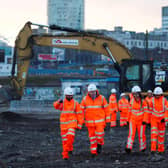 Prime Minister Boris Johnson talks with apprentices during a visit to Curzon Street railway station in Birmingham where the HS2 rail project is under construction.