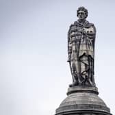 The statue of Henry Dundas 1st Viscount Melville on top of a 150ft column, known as the Melville Monument, stands in St Andrew Square, Edinburgh.